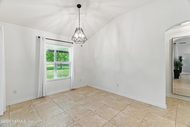 71 Irish Rose Rd, Saint Augustine, FL 32092 - empty room featuring arched walkways, light tile patterned floors, lofted ceiling, baseboards, and a chandelier