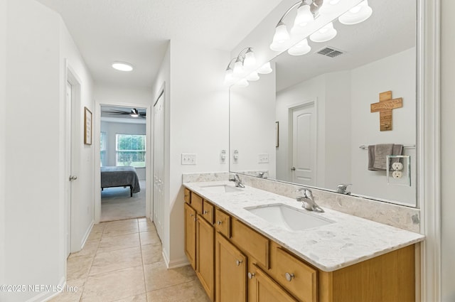 71 Irish Rose Rd, Saint Augustine, FL 32092 - ensuite bathroom with double vanity, tile patterned floors, a ceiling fan, and baseboards