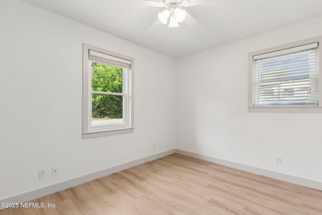1411 Leon St, Fernandina Beach, FL 32034 - empty room with wood finished floors, baseboards, and ceiling fan