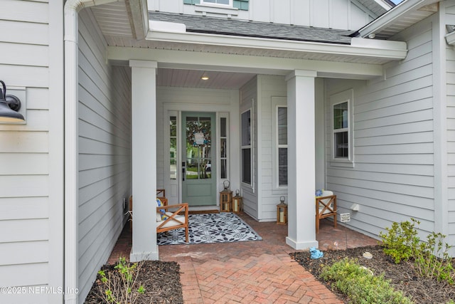 37 High Ridge Pt, Ponte Vedra, FL 32081 - entrance to property with board and batten siding, a porch, and roof with shingles