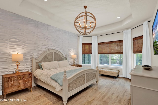 37 High Ridge Pt, Ponte Vedra, FL 32081 - bedroom featuring a tray ceiling, a chandelier, light wood-style floors, and recessed lighting