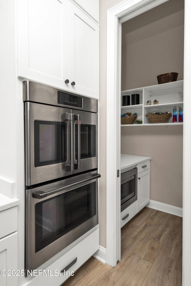 37 High Ridge Pt, Ponte Vedra, FL 32081 - kitchen featuring appliances with stainless steel finishes, light wood-style floors, and white cabinets