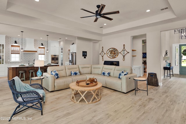37 High Ridge Pt, Ponte Vedra, FL 32081 - living area featuring a raised ceiling, light wood-style flooring, ceiling fan, and recessed lighting