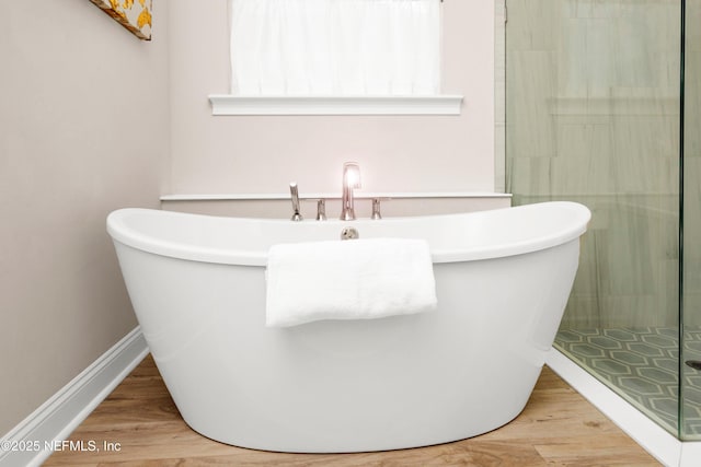 37 High Ridge Pt, Ponte Vedra, FL 32081 - full bath featuring a stall shower, wood finished floors, and a freestanding bath