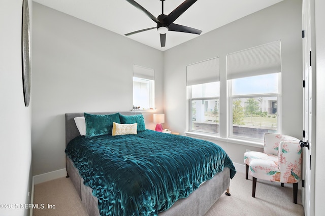 bedroom featuring carpet floors, baseboards, and ceiling fan