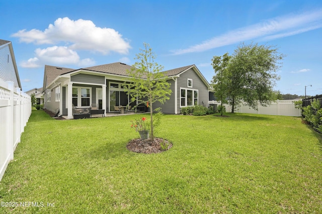rear view of house with roof with shingles and an outdoor living space
