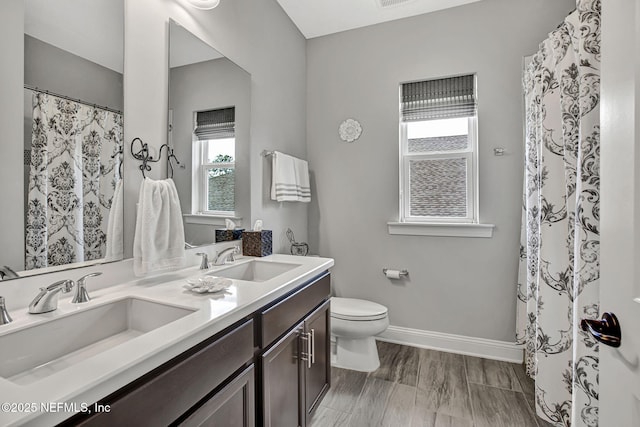 252 Pine Haven Dr, Saint Johns, FL 32259 - full bath featuring baseboards, toilet, and double vanity