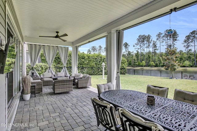 252 Pine Haven Dr, Saint Johns, FL 32259 - sunroom with outdoor dining area, outdoor lounge area, a ceiling fan, and a water view