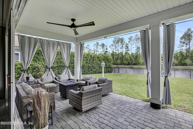 252 Pine Haven Dr, Saint Johns, FL 32259 - view of patio featuring a water view, ceiling fan, an outdoor living space with a fire pit, and view of wooded area