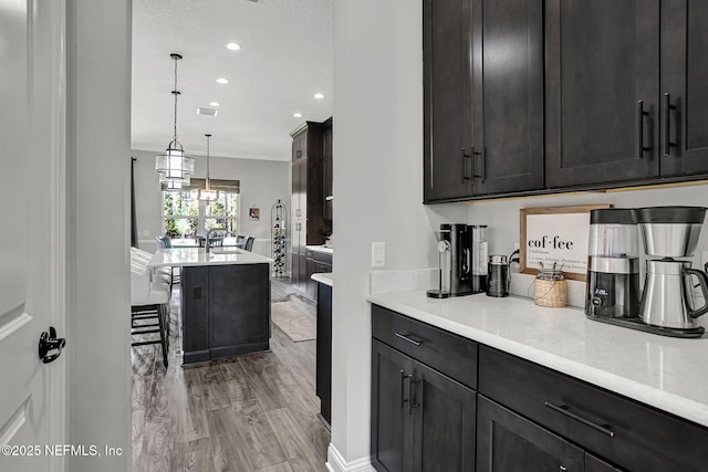 252 Pine Haven Dr, Saint Johns, FL 32259 - kitchen featuring light countertops, recessed lighting, hanging light fixtures, and a kitchen breakfast bar