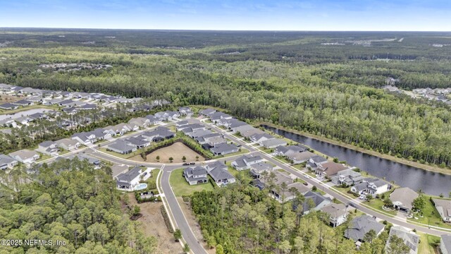 252 Pine Haven Dr, Saint Johns, FL 32259 - aerial view of property's location featuring a forest, a large body of water, and nearby suburban area