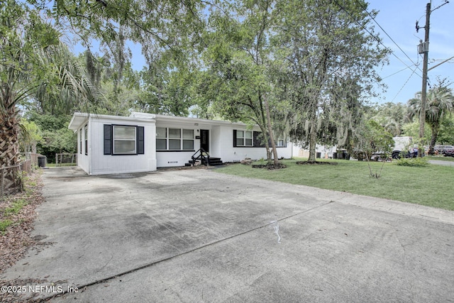 3733 Cambay Pl, Jacksonville, FL 32210 - view of front of home with concrete driveway, entry steps, and a front yard