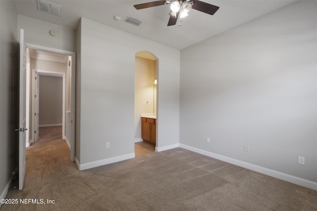 1456 Coopers Hawk Way, Middleburg, FL 32068 - unfurnished bedroom featuring arched walkways, carpet flooring, baseboards, and ensuite bathroom