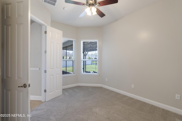 1456 Coopers Hawk Way, Middleburg, FL 32068 - unfurnished room featuring light colored carpet, a ceiling fan, and baseboards