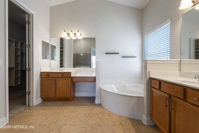 1456 Coopers Hawk Way, Middleburg, FL 32068 - full bath with a bath, a walk in closet, tile patterned floors, and two vanities