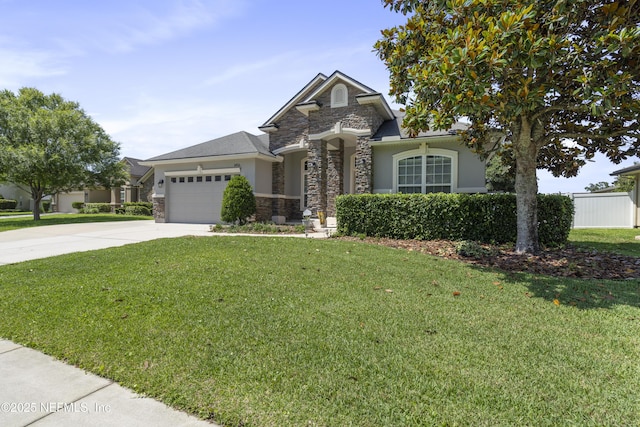 1456 Coopers Hawk Way, Middleburg, FL 32068 - view of front of home featuring stone siding, driveway, an attached garage, and stucco siding