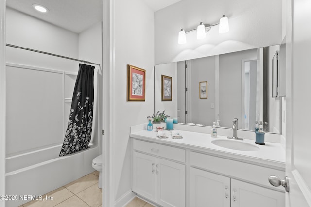 bathroom with tile patterned flooring, toilet, vanity, and shower / bath combination with curtain