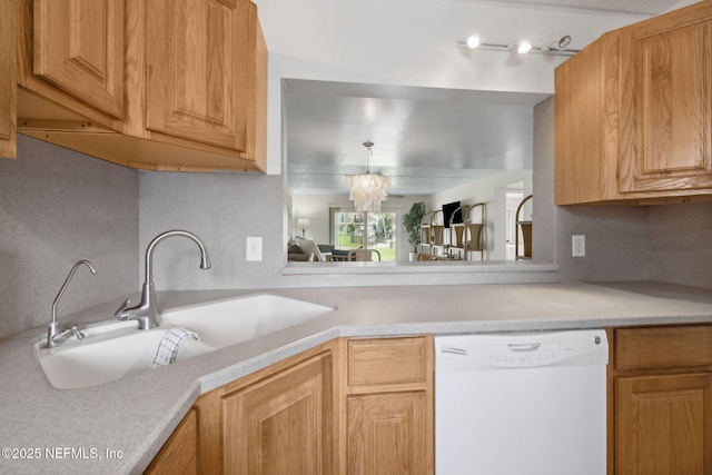 8550 A1A S Unit 340, Saint Augustine, FL 32080 - kitchen with dishwasher, a sink, light countertops, and a chandelier