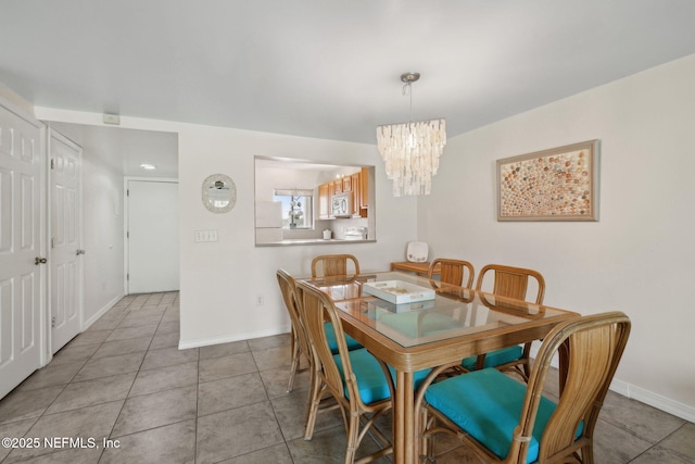 8550 A1A S Unit 340, Saint Augustine, FL 32080 - dining space with a chandelier, tile patterned floors, and baseboards