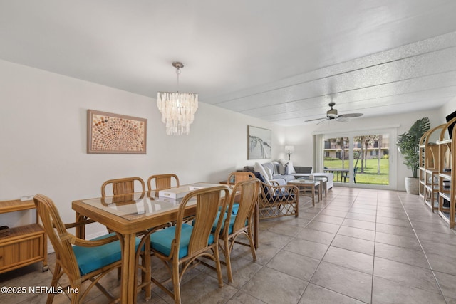 8550 A1A S Unit 340, Saint Augustine, FL 32080 - tiled dining room featuring a chandelier and a ceiling fan