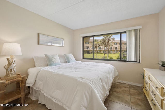 8550 A1A S Unit 340, Saint Augustine, FL 32080 - bedroom with baseboards and tile patterned floors