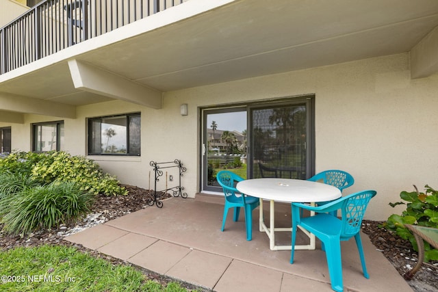 8550 A1A S Unit 340, Saint Augustine, FL 32080 - view of patio featuring outdoor dining area and a balcony