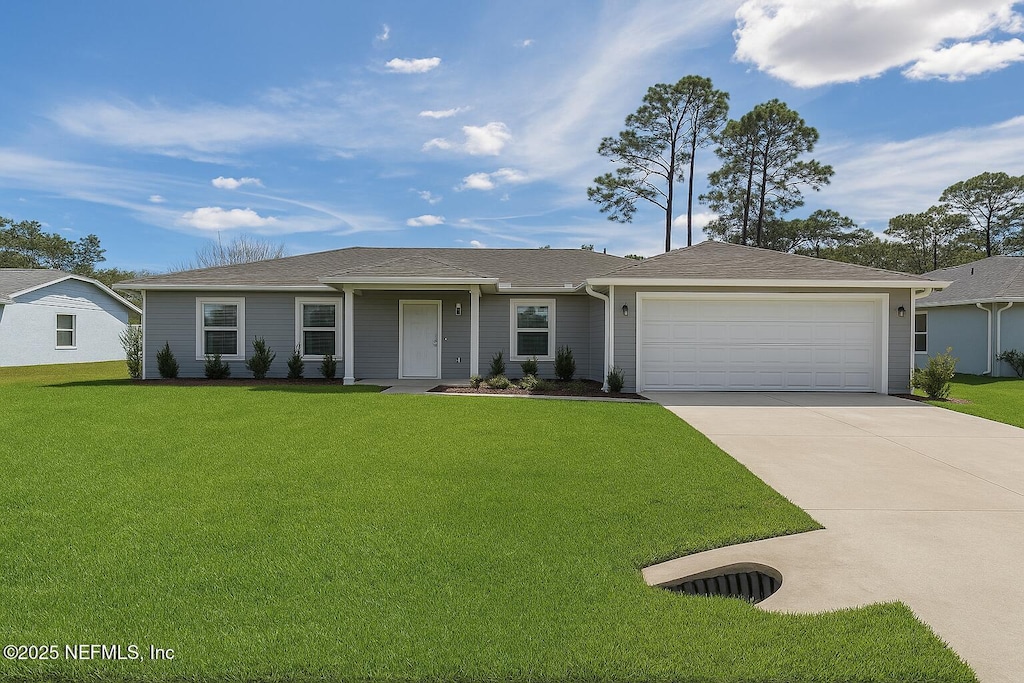 single story home featuring an attached garage, concrete driveway, a front yard, and a shingled roof