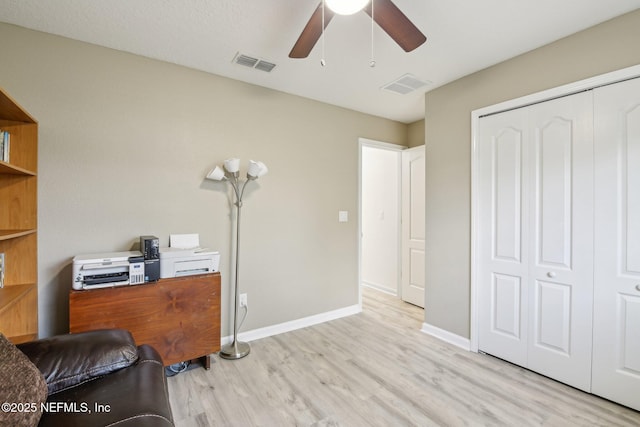 3228 Deer Creek Dr, Middleburg, FL 32068 - office featuring light wood-style flooring, ceiling fan, and baseboards