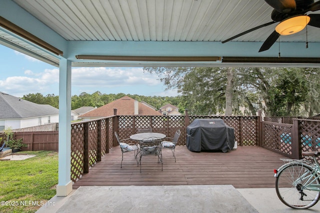 3228 Deer Creek Dr, Middleburg, FL 32068 - wooden deck featuring outdoor dining space, ceiling fan, area for grilling, and fence