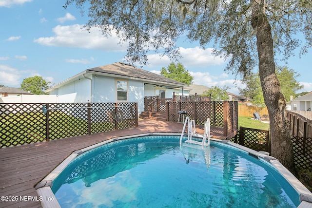 3228 Deer Creek Dr, Middleburg, FL 32068 - outdoor pool with a wooden deck and fence