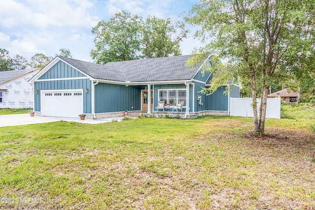 4282 Wolfe Dr, Macclenny, FL 32063 - view of front of home with a garage, board and batten siding, driveway, a shingled roof, and a porch
