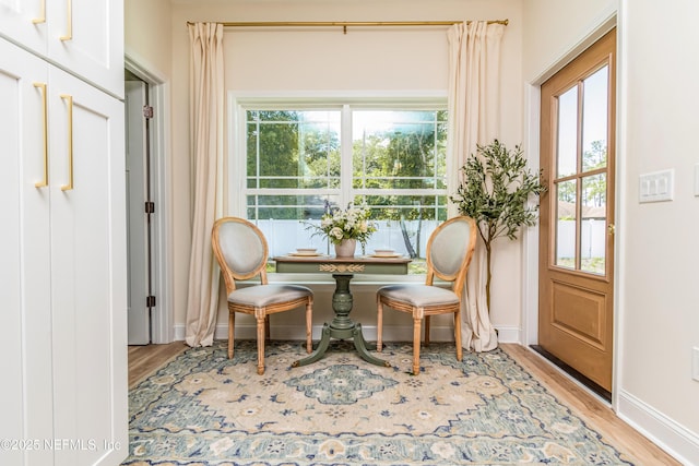 4282 Wolfe Dr, Macclenny, FL 32063 - sitting room with baseboards, light wood-style flooring, and healthy amount of natural light