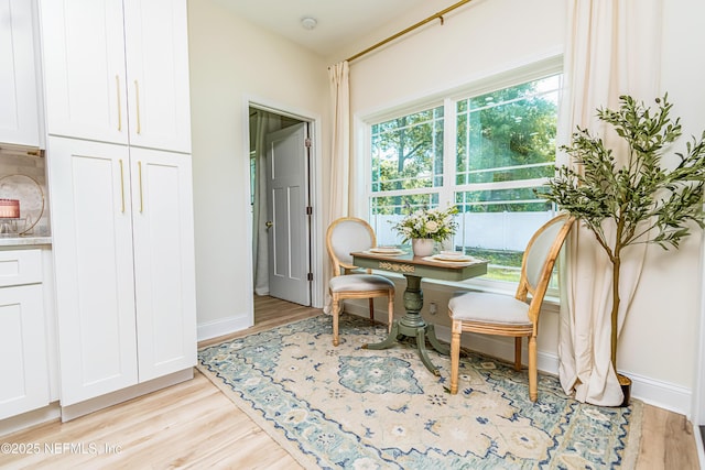 4282 Wolfe Dr, Macclenny, FL 32063 - dining space with light wood-style flooring and baseboards