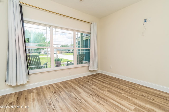 4282 Wolfe Dr, Macclenny, FL 32063 - unfurnished room featuring wood finished floors, baseboards, and plenty of natural light