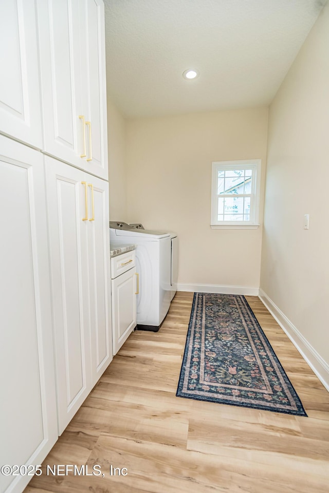 4282 Wolfe Dr, Macclenny, FL 32063 - washroom with cabinet space, baseboards, separate washer and dryer, recessed lighting, and light wood-style flooring