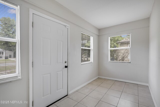 944 Bunker Hill Blvd, Jacksonville, FL 32208 - entrance foyer with baseboards and light tile patterned flooring