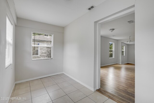 944 Bunker Hill Blvd, Jacksonville, FL 32208 - unfurnished room featuring a chandelier, baseboards, and light wood finished floors