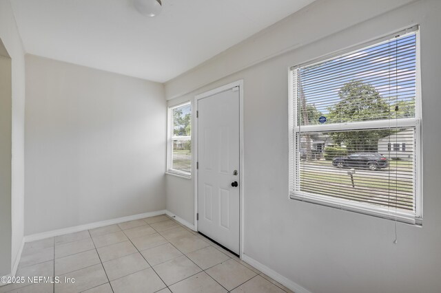 944 Bunker Hill Blvd, Jacksonville, FL 32208 - entryway featuring baseboards and light tile patterned floors