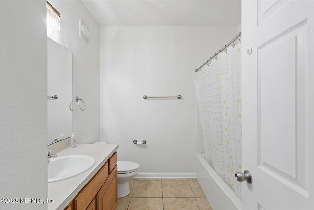 full bath with vanity, toilet, tile patterned flooring, baseboards, and shower / bath combo with shower curtain