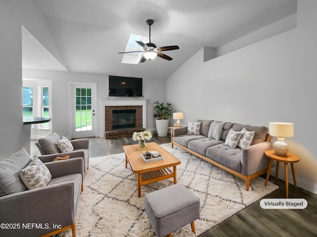 3055 Nautilus Rd, Middleburg, FL 32068 - living room featuring ceiling fan, lofted ceiling, wood finished floors, and a fireplace