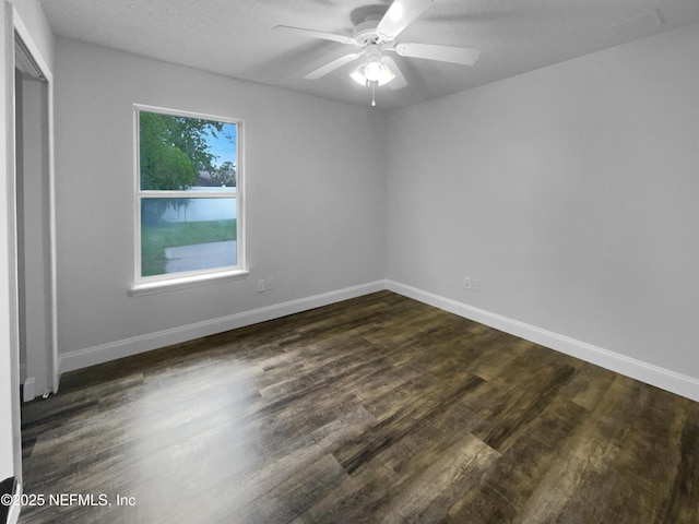 3055 Nautilus Rd, Middleburg, FL 32068 - unfurnished room with a ceiling fan, dark wood-type flooring, baseboards, and a textured ceiling