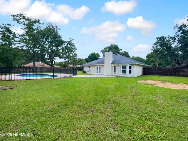 3055 Nautilus Rd, Middleburg, FL 32068 - back of house with a patio area, a chimney, and stucco siding