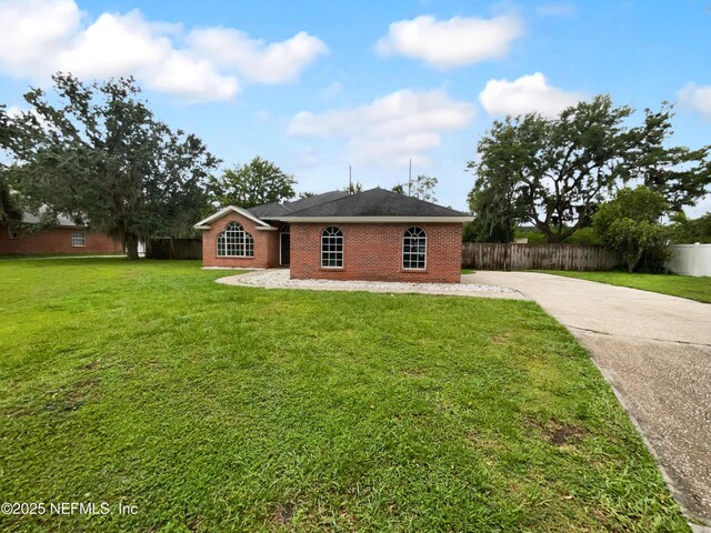 3055 Nautilus Rd, Middleburg, FL 32068 - view of front of house featuring concrete driveway and brick siding