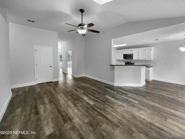 3055 Nautilus Rd, Middleburg, FL 32068 - unfurnished living room featuring lofted ceiling, dark wood-style flooring, ceiling fan, and baseboards