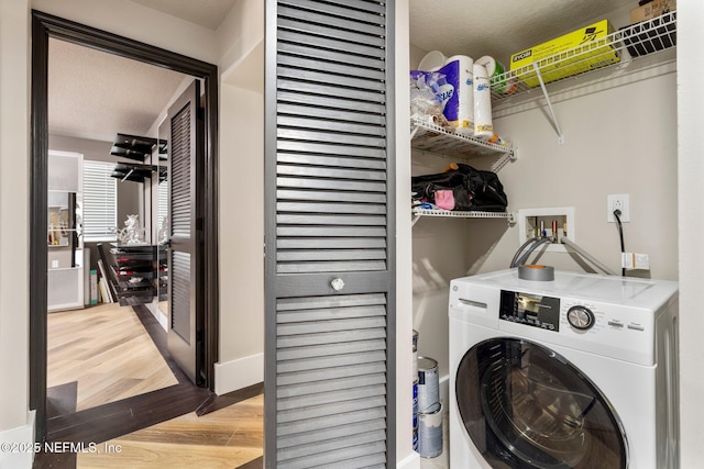 5375 Ortega Farms Blvd Unit 408, Jacksonville, FL 32210 - laundry room featuring washer / dryer, wood finished floors, and baseboards