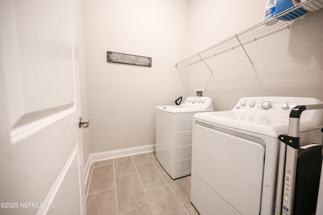 152 Cloverbrook Rd, Saint Johns, FL 32259 - clothes washing area with independent washer and dryer, baseboards, and light tile patterned floors