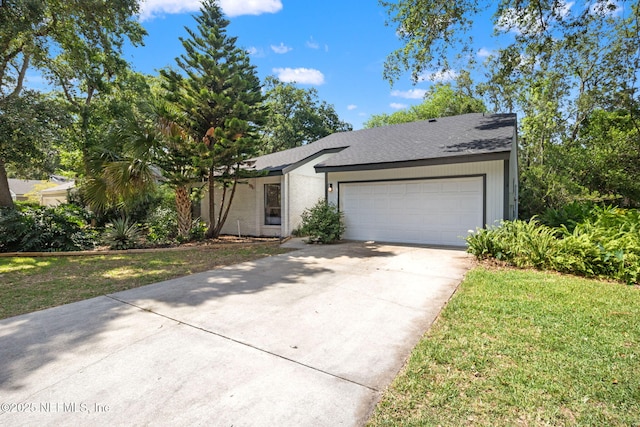 550 Robles Ln, Ponte Vedra Beach, FL 32082 - view of front of home featuring concrete driveway, an attached garage, roof with shingles, and a front lawn