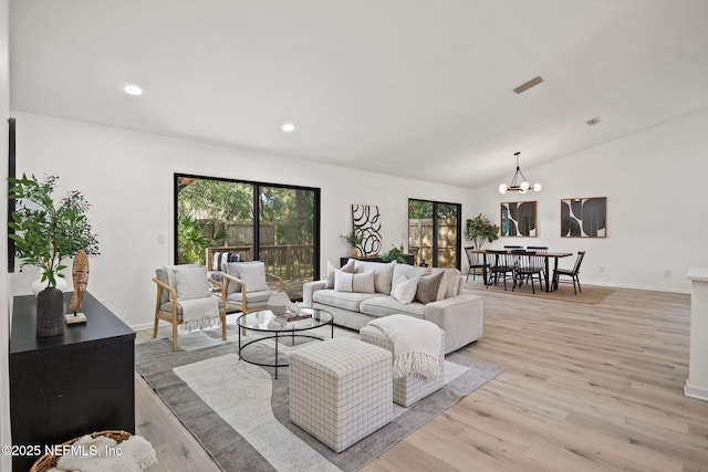 550 Robles Ln, Ponte Vedra Beach, FL 32082 - living area featuring light wood-style flooring, a chandelier, lofted ceiling, baseboards, and recessed lighting
