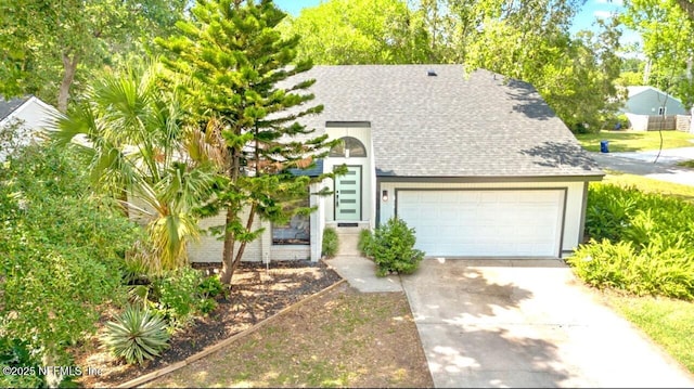 550 Robles Ln, Ponte Vedra Beach, FL 32082 - view of front of house featuring driveway, roof with shingles, and a garage