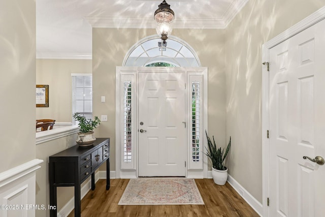 641 Thornwood Ln, Orange Park, FL 32073 - foyer with wood finished floors, crown molding, and baseboards